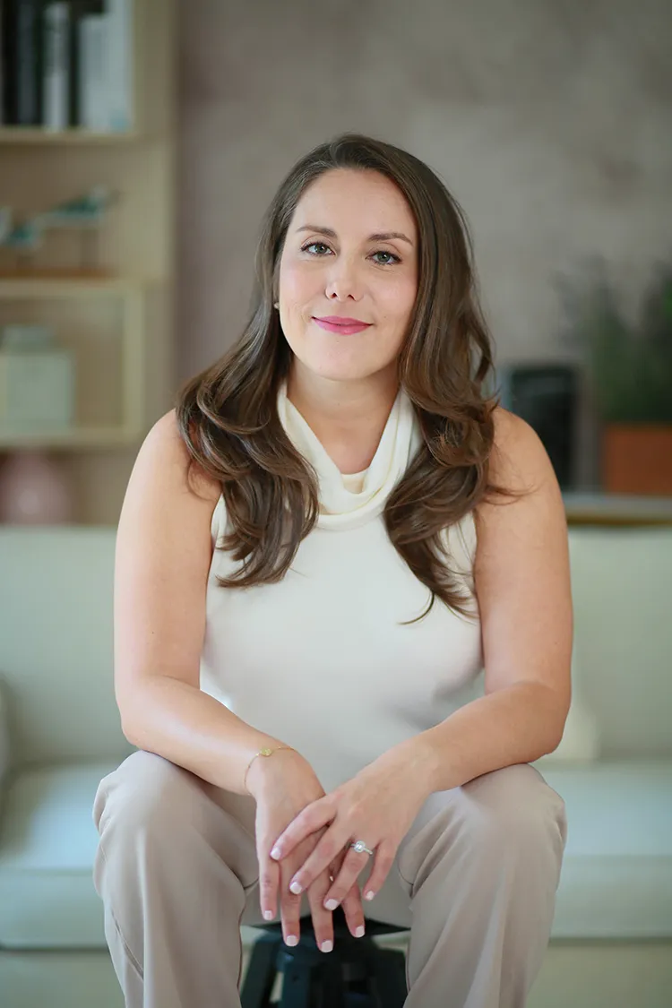 Carla Escot, burnout coach, smiling warmly at the camera